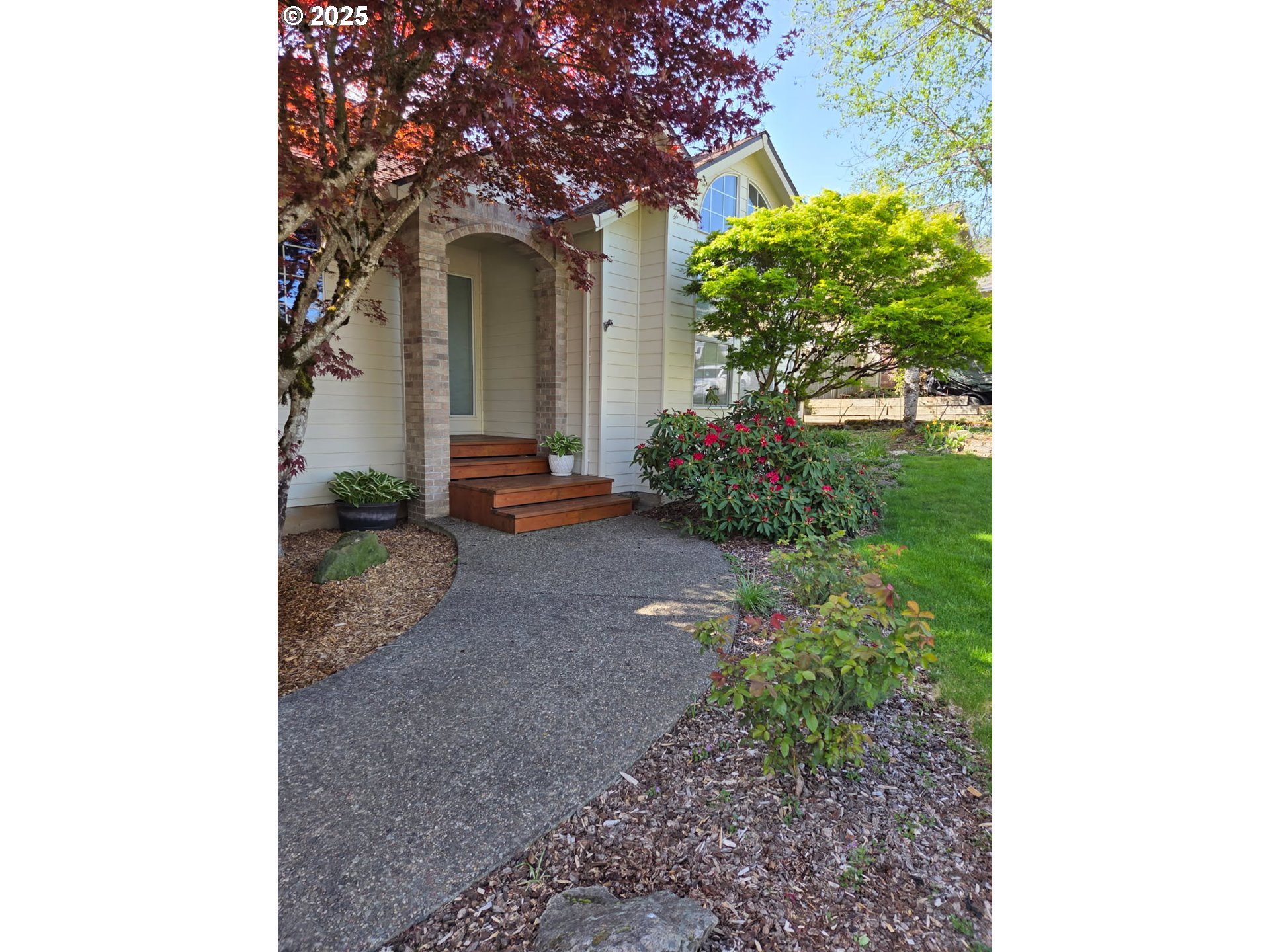 17265 Amber Lane Sandy, OR 97055 - Photo 3 of 46 a front view of a house with lots of green space