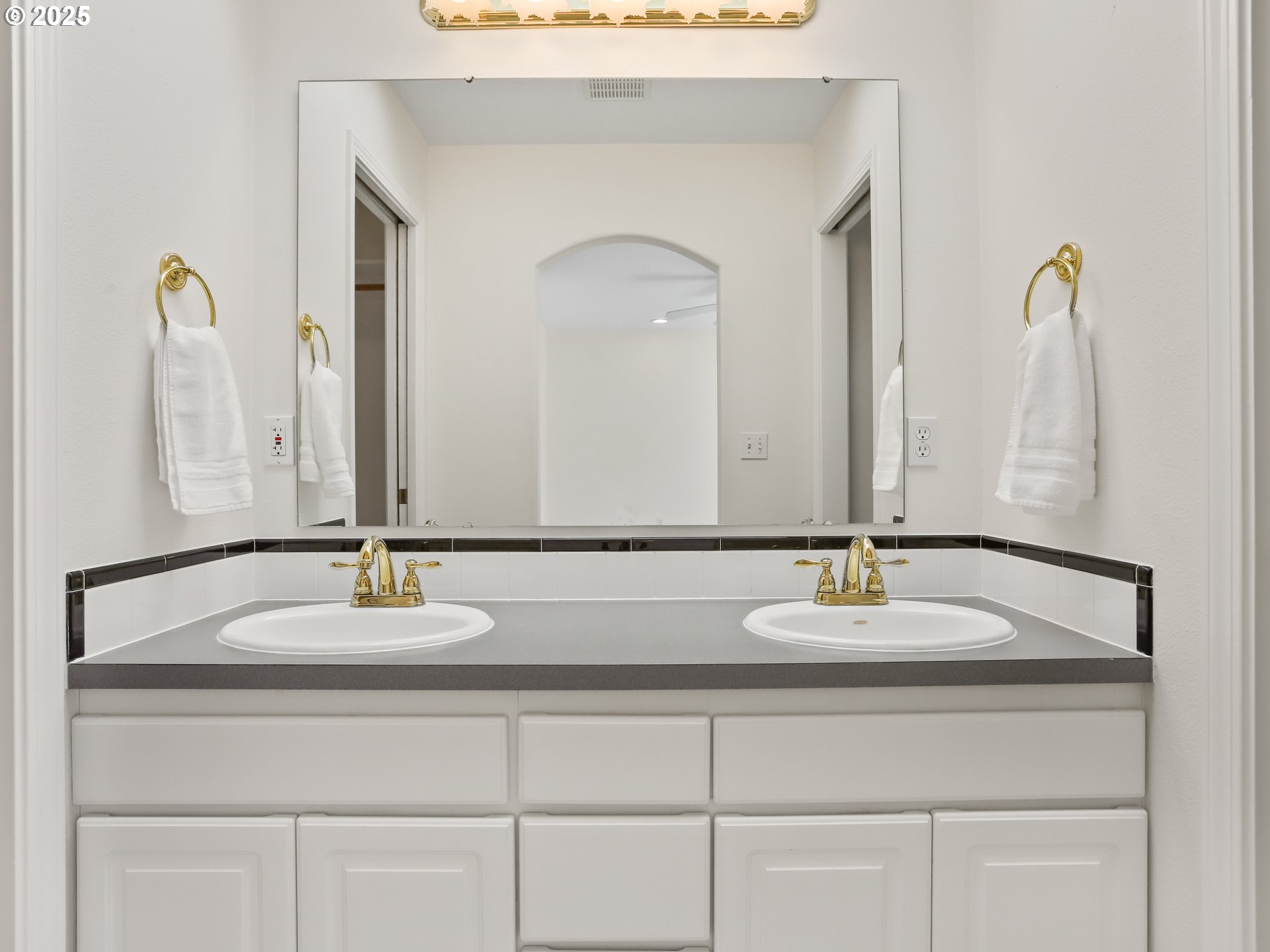 17265 Amber Lane Sandy, OR 97055 - Photo 33 of 46 a bathroom with a double vanity sink and a mirror
