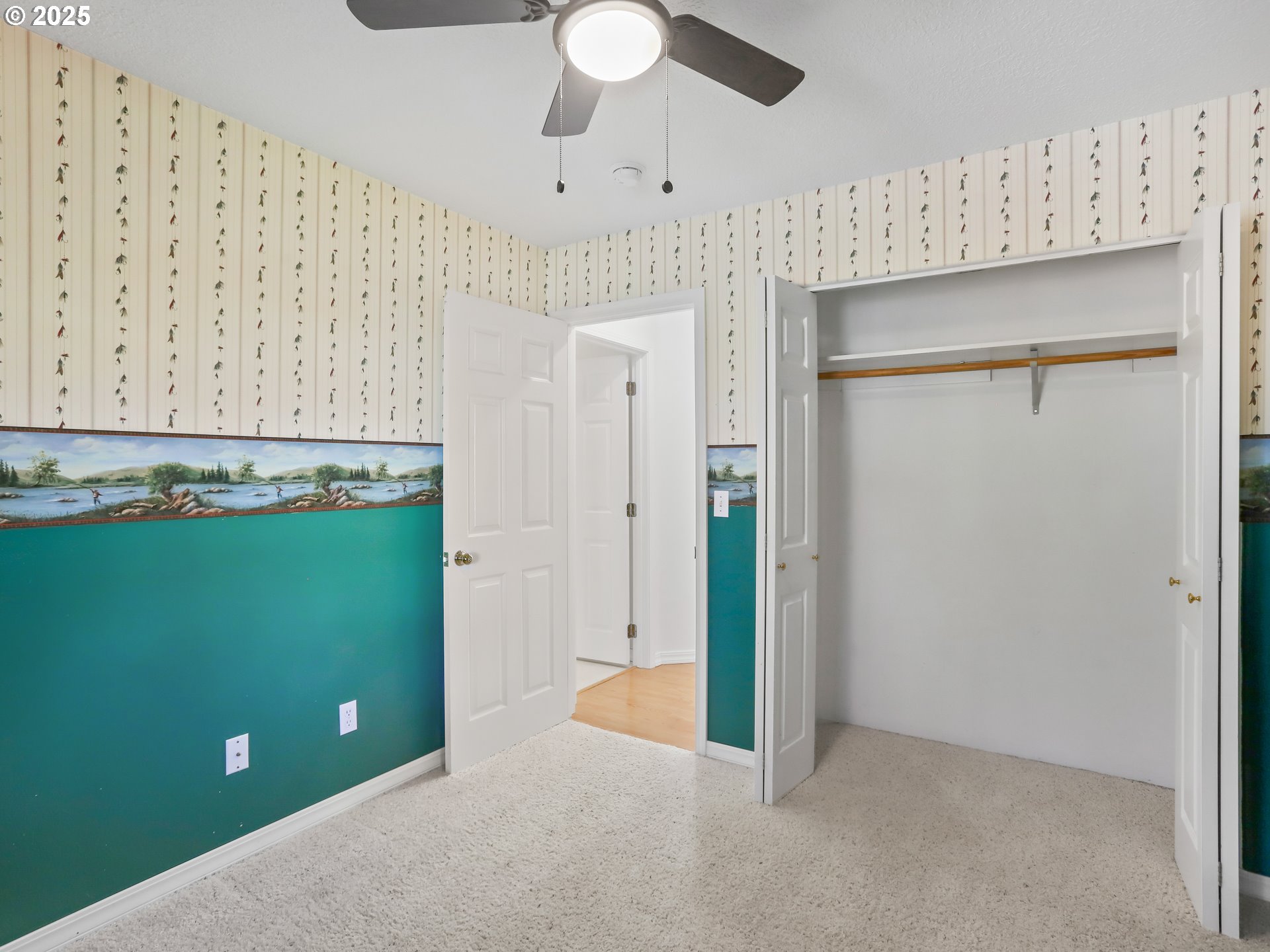 17265 Amber Lane Sandy, OR 97055 - Photo 37 of 46 a view of an empty room with cabinet and a ceiling fan
