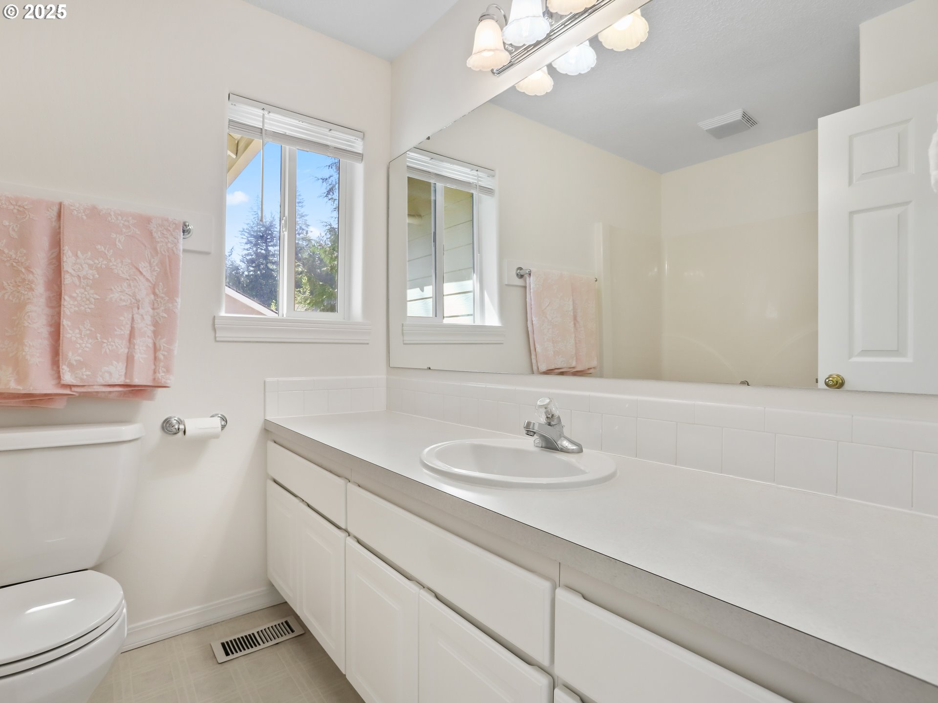 17265 Amber Lane Sandy, OR 97055 - Photo 38 of 46 a bathroom with a sink a toilet and a mirror