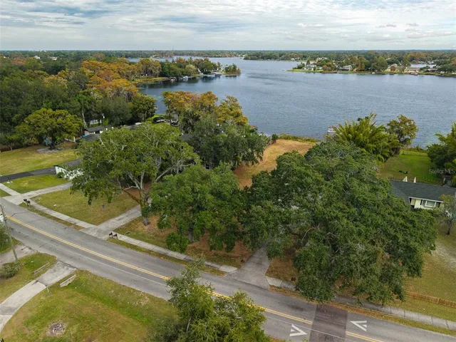 an aerial view of a residential houses with outdoor space