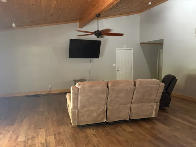 a living room with a couch and a flat screen tv