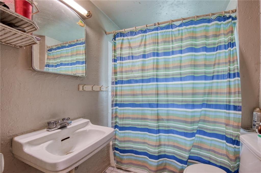 101 Ziegler Street Mars, PA 16046 - Photo 13 of 29 a bathroom with a sink and mirror