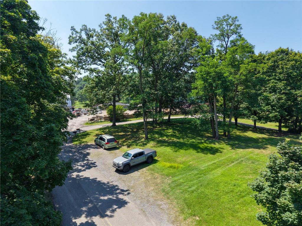 101 Ziegler Street Mars, PA 16046 - Photo 16 of 29 a view of a backyard with table and chairs and a fire pit