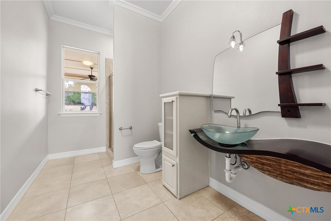 6717 Springwood Court Temple, TX 76502 - Photo 19 of 33 a bathroom with a sink and a toilet