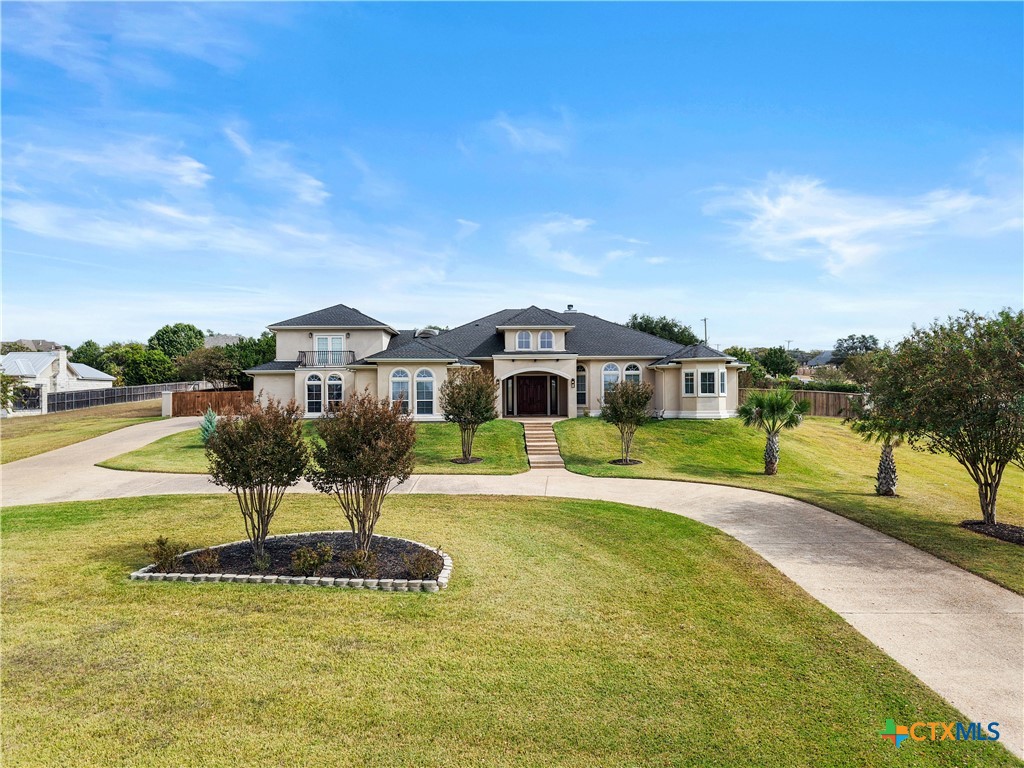 6717 Springwood Court Temple, TX 76502 - Photo 2 of 33 a front view of a house with swimming pool