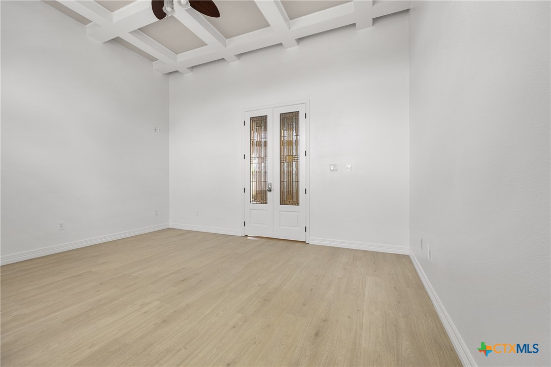 6717 Springwood Court Temple, TX 76502 - Photo 22 of 33 an empty room with wooden floor and windows