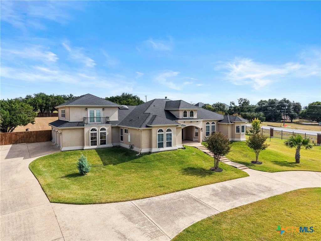 6717 Springwood Court Temple, TX 76502 - Photo 3 of 33 a view of a house with a swimming pool