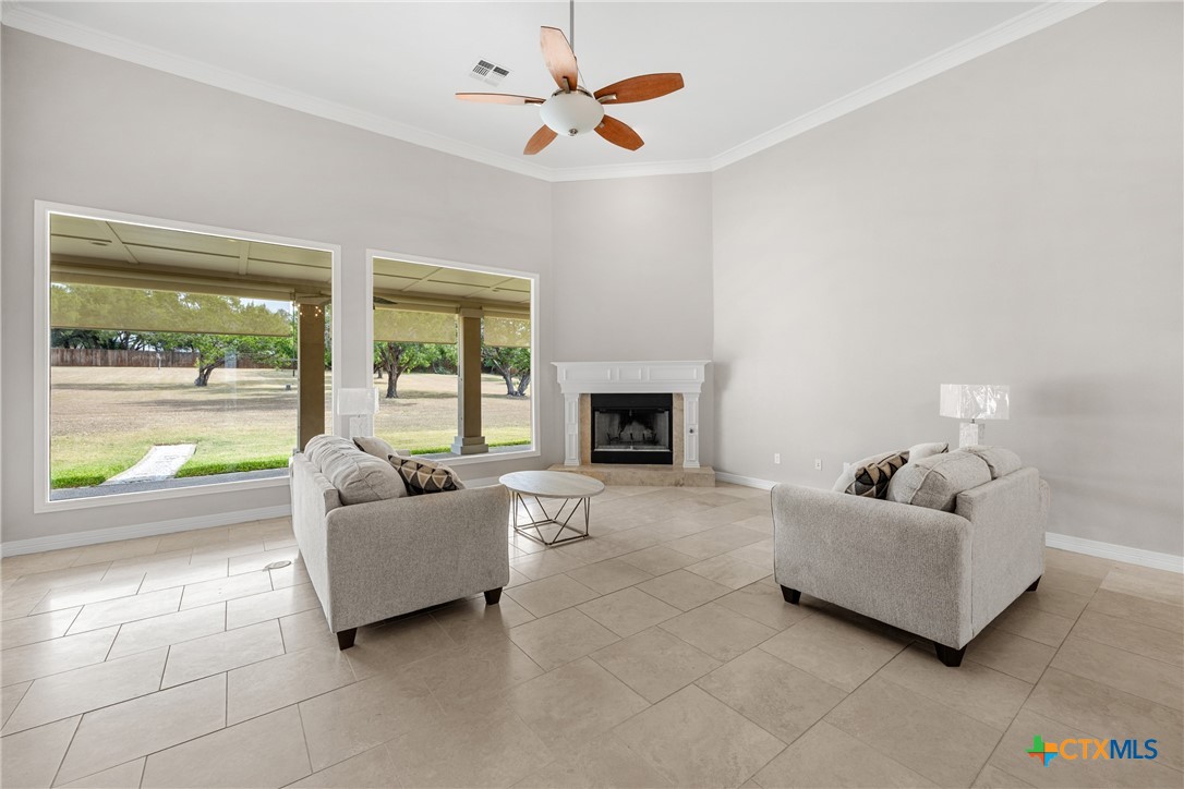 6717 Springwood Court Temple, TX 76502 - Photo 7 of 33 a living room with furniture and a fireplace
