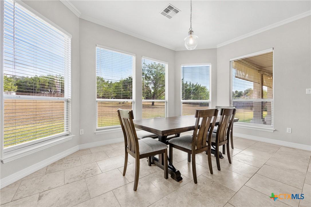 6717 Springwood Court Temple, TX 76502 - Photo 8 of 33 a view of a dining room with furniture and windows