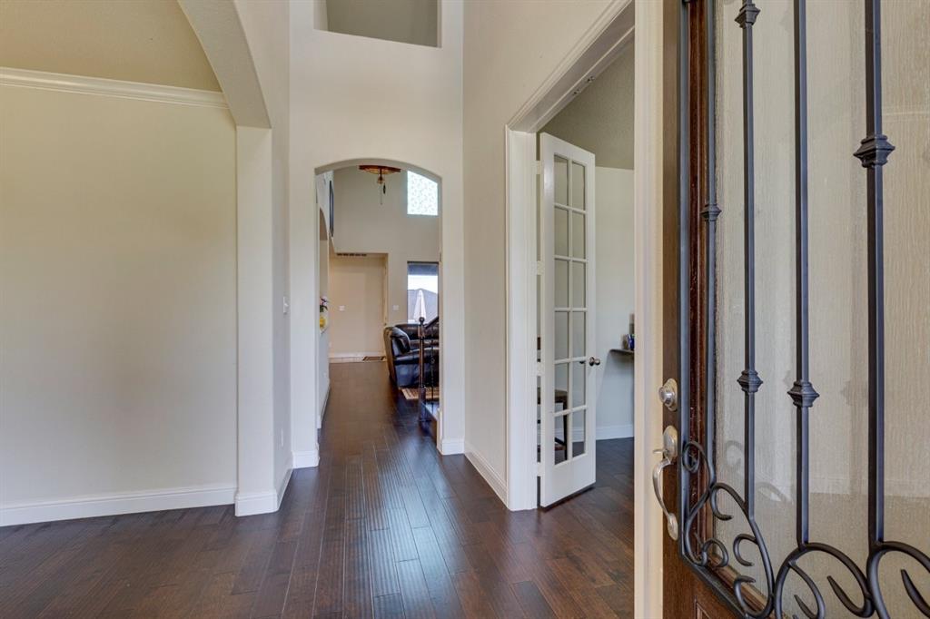 336 Red Hill Road Sunnyvale, TX 75182 - Photo 3 of 36 a view of a hallway with wooden floor and a livingroom