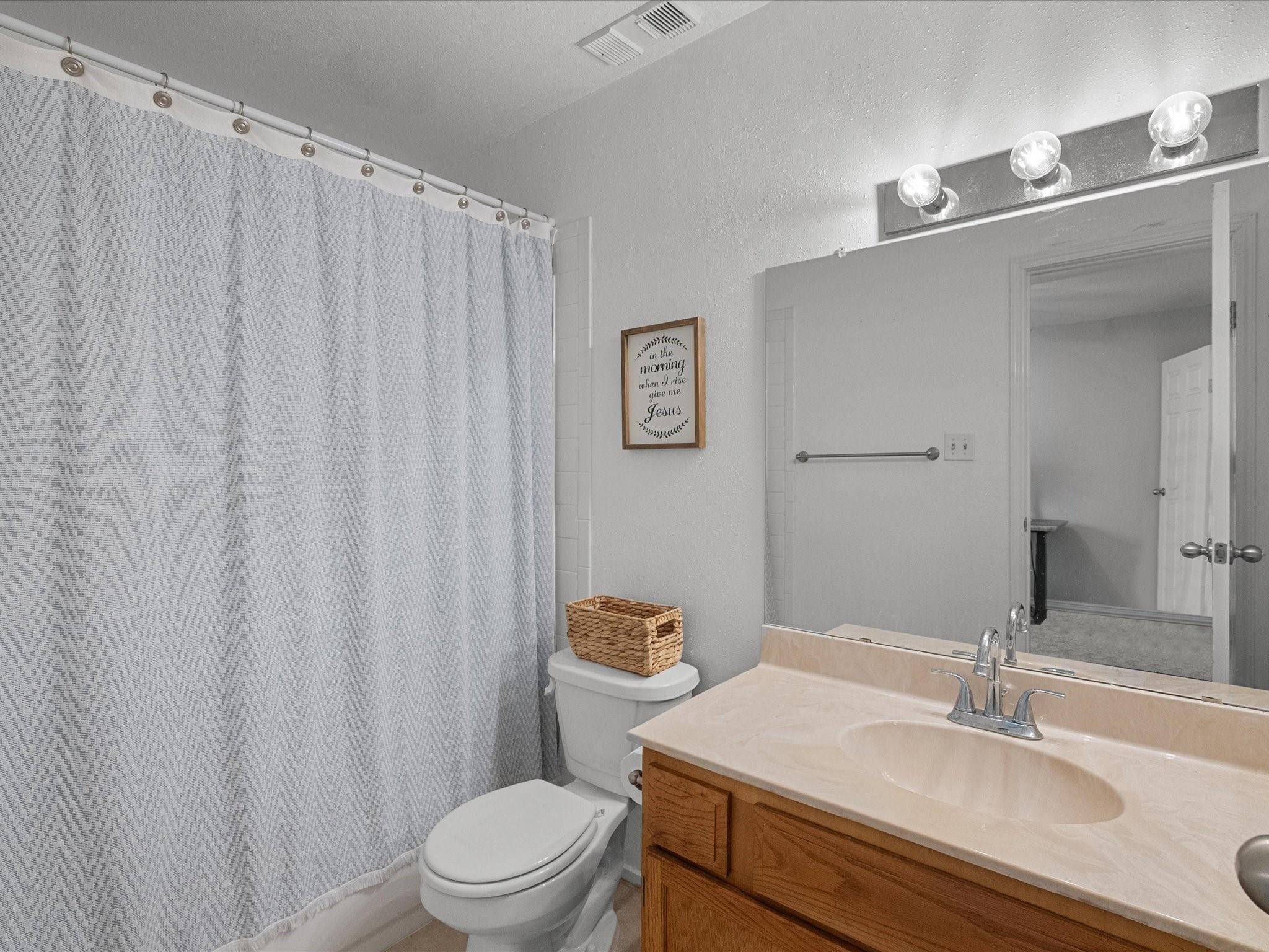 18515 Egret Bay Boulevard, Unit 1101 Webster, TX 77058 - Photo 17 of 30 a bathroom with a granite countertop sink and a mirror