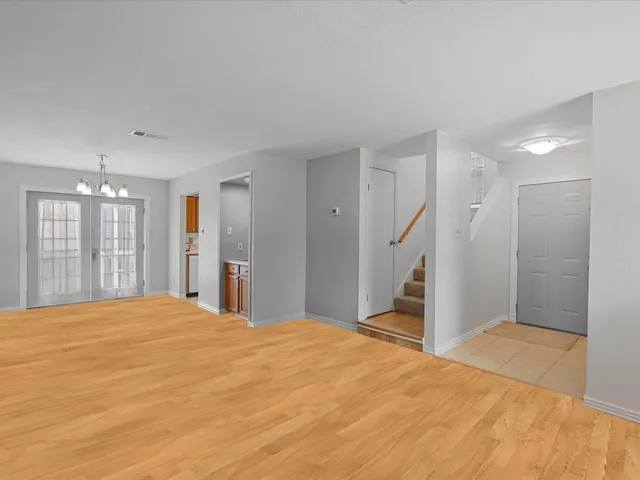 a bedroom with a large bed closet and a window