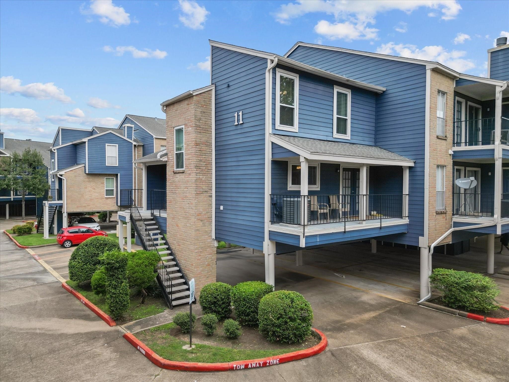 18515 Egret Bay Boulevard, Unit 1101 Webster, TX 77058 - Photo 24 of 30 a view of a house with a small yard and sitting area