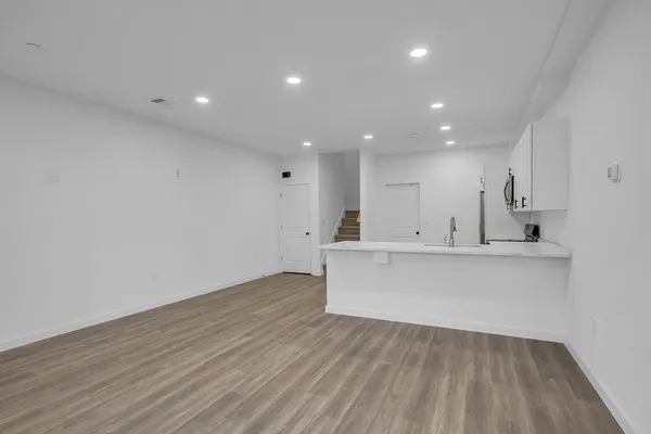 a view of kitchen with wooden floor