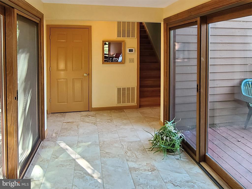 1245 Khyber Pass Road Linden, VA 22642 - Photo 31 of 55 Hallway, with sliders to front and back of home