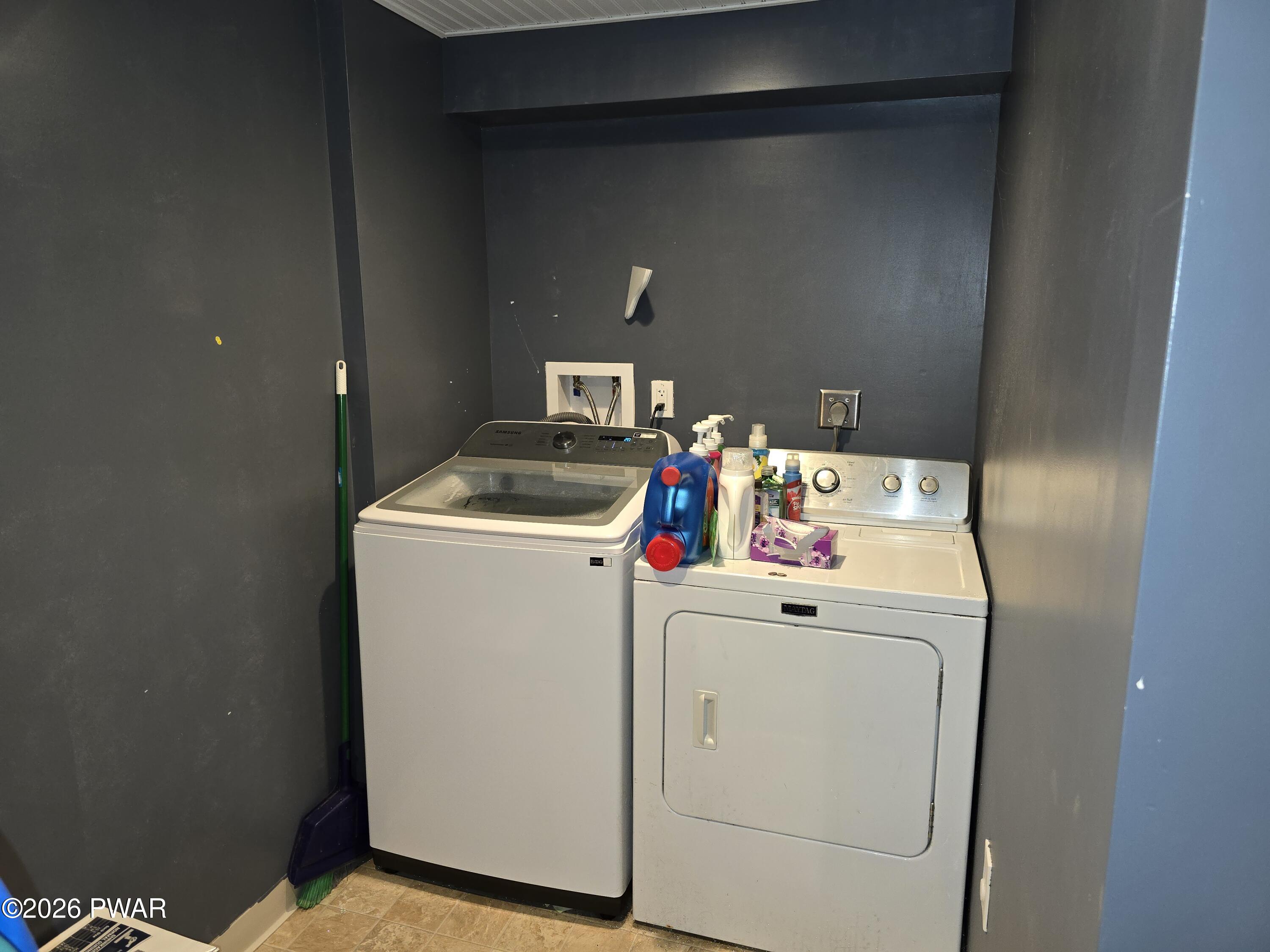 107 Keystone Hls Road, Unit 404 Factoryville, PA 18419 - Photo 21 of 23 a utility room with dryer and washer
