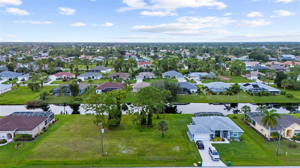 29 Marker Road Rotonda West, FL 33947 - Photo 2 of 11 an aerial view of residential houses with outdoor space and trees