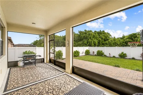 a view of an house with backyard porch and sitting area
