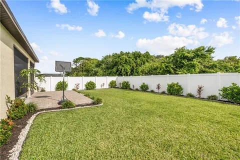 a front view of a house with a garden and plants