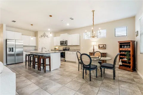 a view of a dining room kitchen and a window