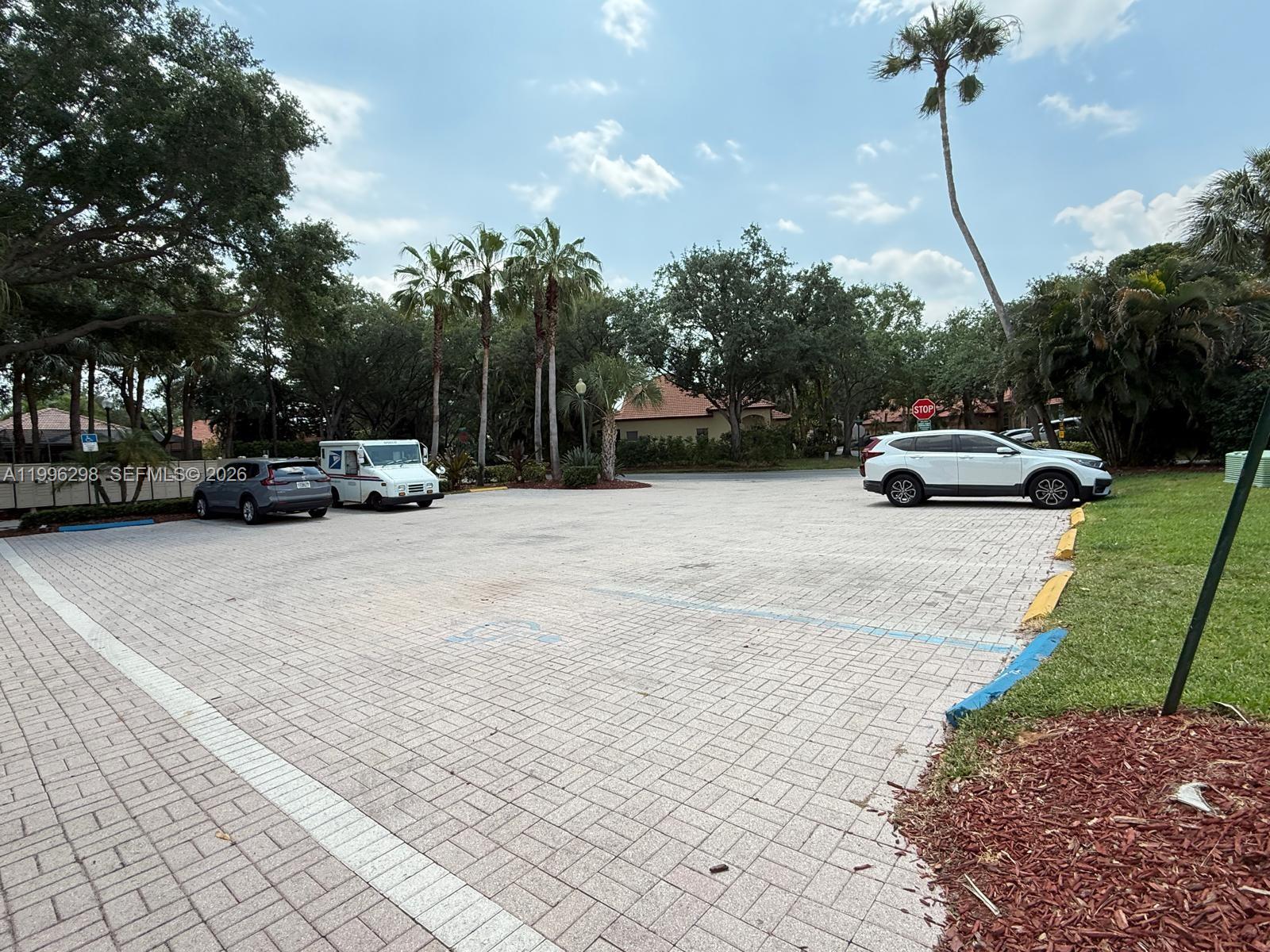 1016 Via Jardin, Unit 1016 Riviera Beach, FL 33418 - Photo 18 of 21 a view of street with parked cars