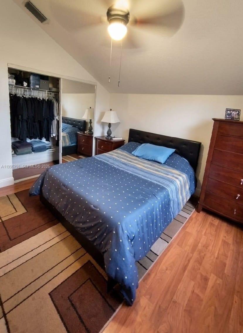 1016 Via Jardin, Unit 1016 Riviera Beach, FL 33418 - Photo 9 of 15 a bedroom with bed and window