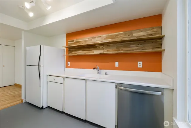 a view of storage and utility room with washer and dryer