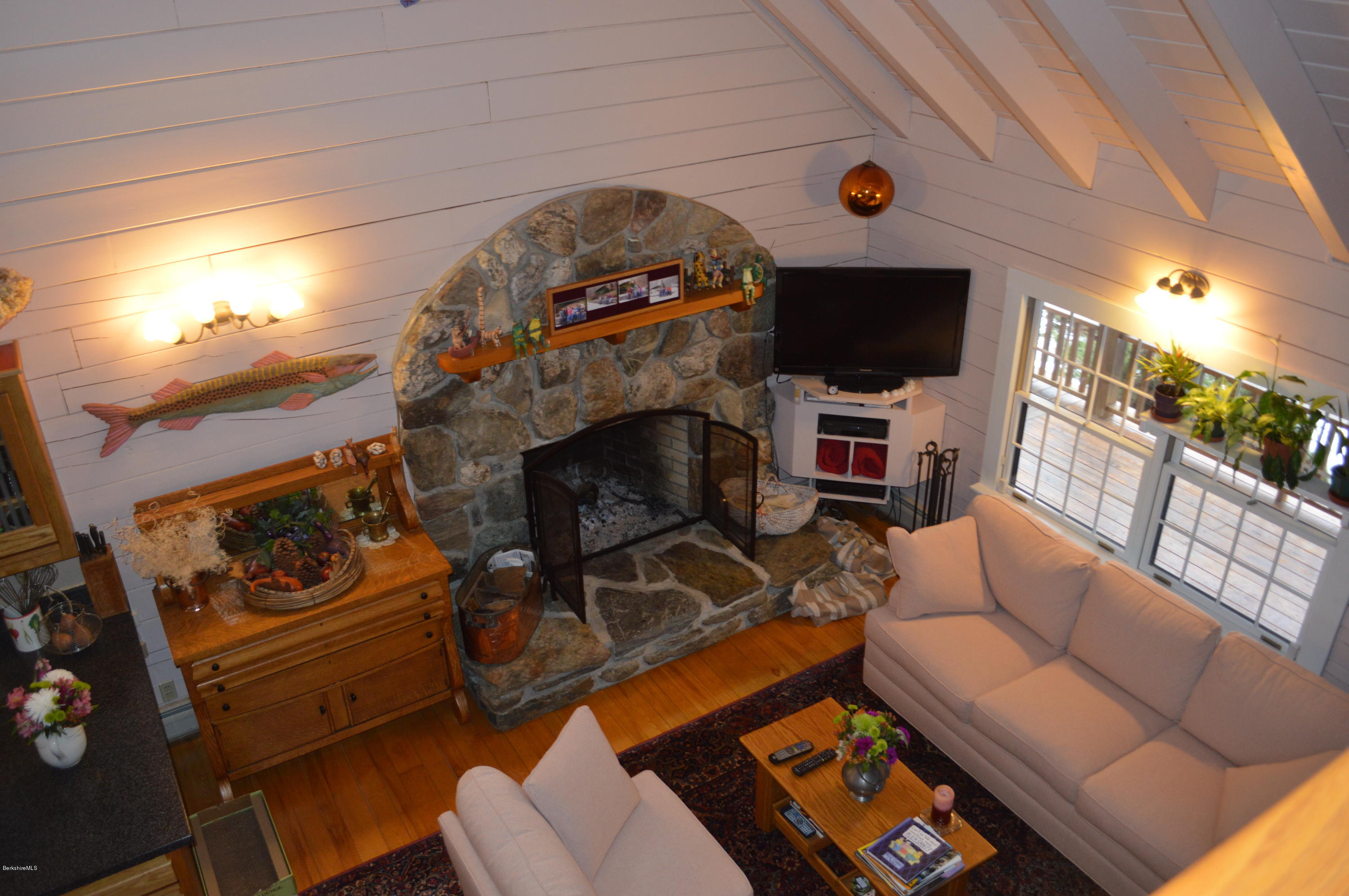 47 Jericho Road Hancock, MA 01267 - Photo 7 of 33 a living room with furniture a flat screen tv and a fireplace