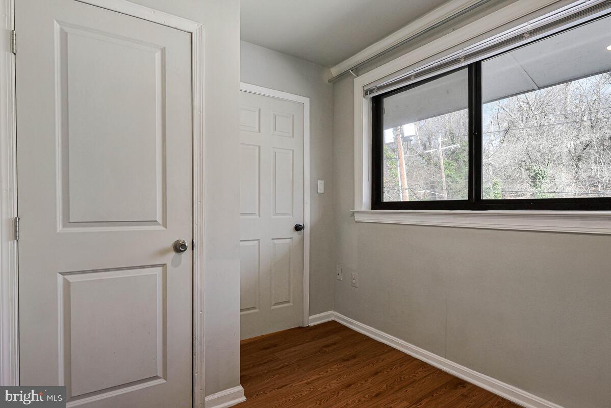 3103 Naylor Road Southeast, Unit 304 Washington, DC 20020 - Photo 19 of 28 a view of a small space with wooden floor and a window