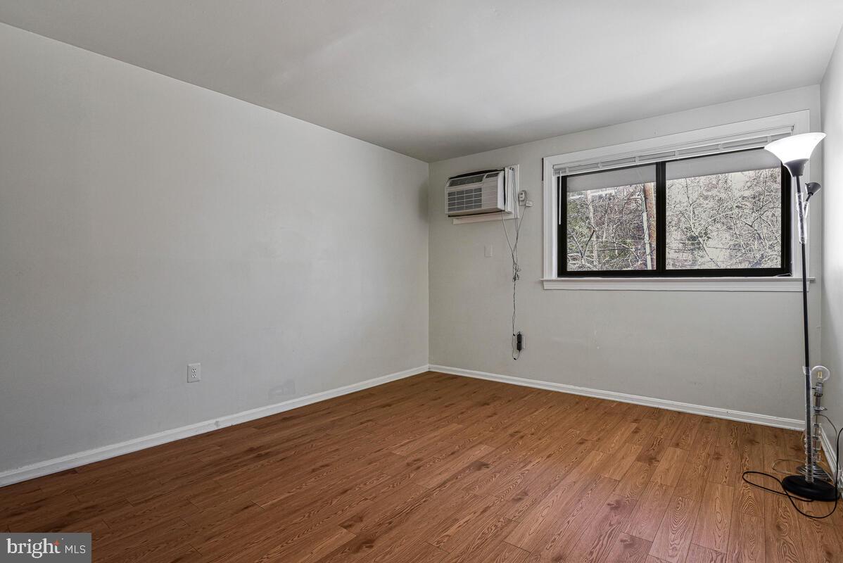 3103 Naylor Road Southeast, Unit 304 Washington, DC 20020 - Photo 23 of 28 a view of empty room with wooden floor and fan