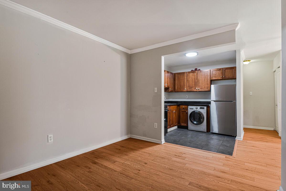 3103 Naylor Road Southeast, Unit 304 Washington, DC 20020 - Photo 7 of 28 a view of a kitchen with a sink and a refrigerator