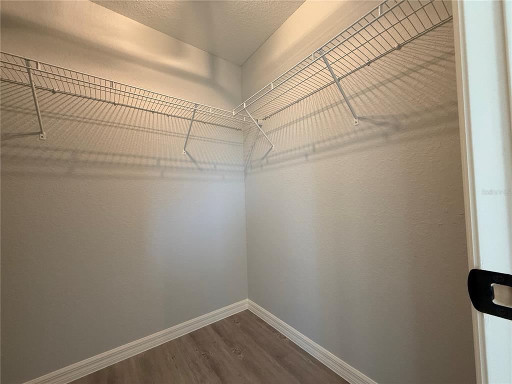 19 Northwest 45th Loop Ocala, FL 34475 - Photo 20 of 28 a view of a room with racks on the wall