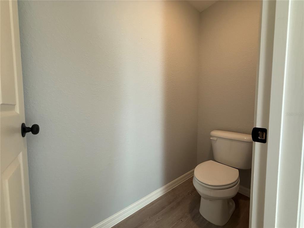 19 Northwest 45th Loop Ocala, FL 34475 - Photo 21 of 28 a white toilet sitting next to a shower