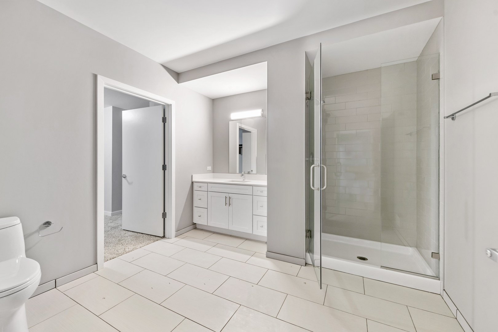 1900 West Lawrence Avenue, Unit 231 Chicago, IL 60640 - Photo 13 of 23 a bathroom with a shower a toilet and a sink