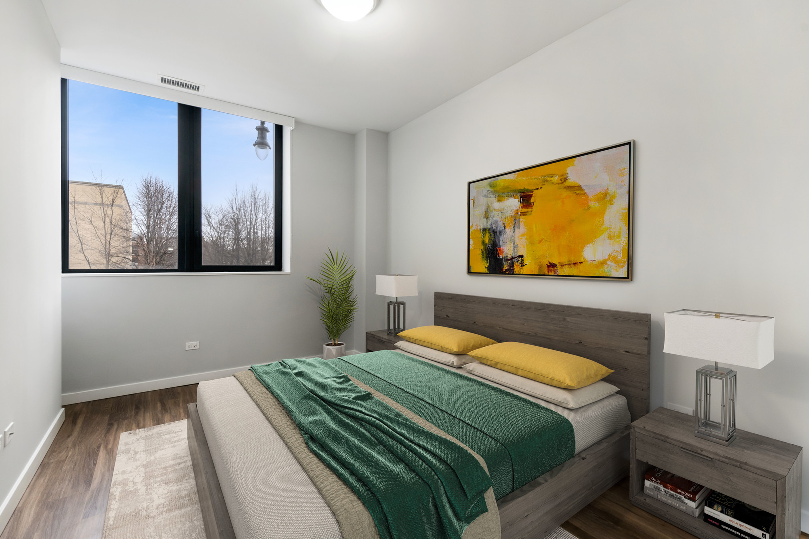 1900 West Lawrence Avenue, Unit 231 Chicago, IL 60640 - Photo 15 of 23 a bedroom with a bed and painting on the wall