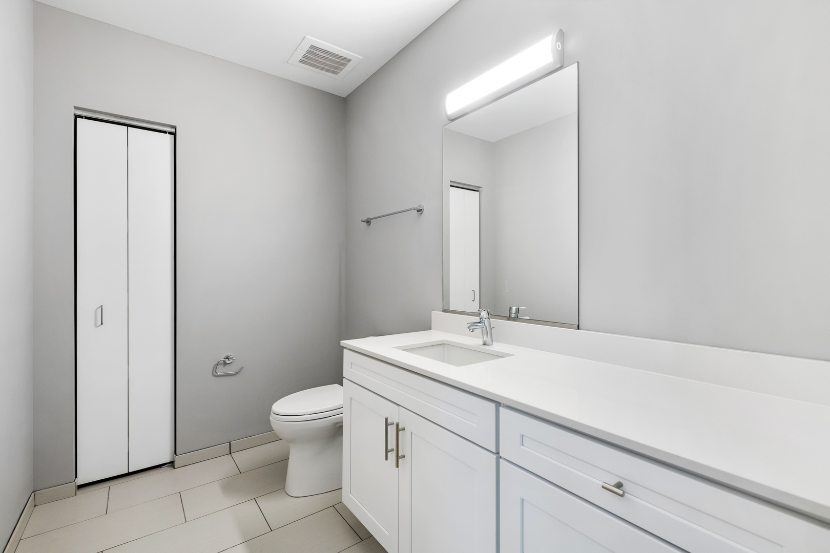 1900 West Lawrence Avenue, Unit 231 Chicago, IL 60640 - Photo 18 of 23 a bathroom with a sink a toilet and mirror
