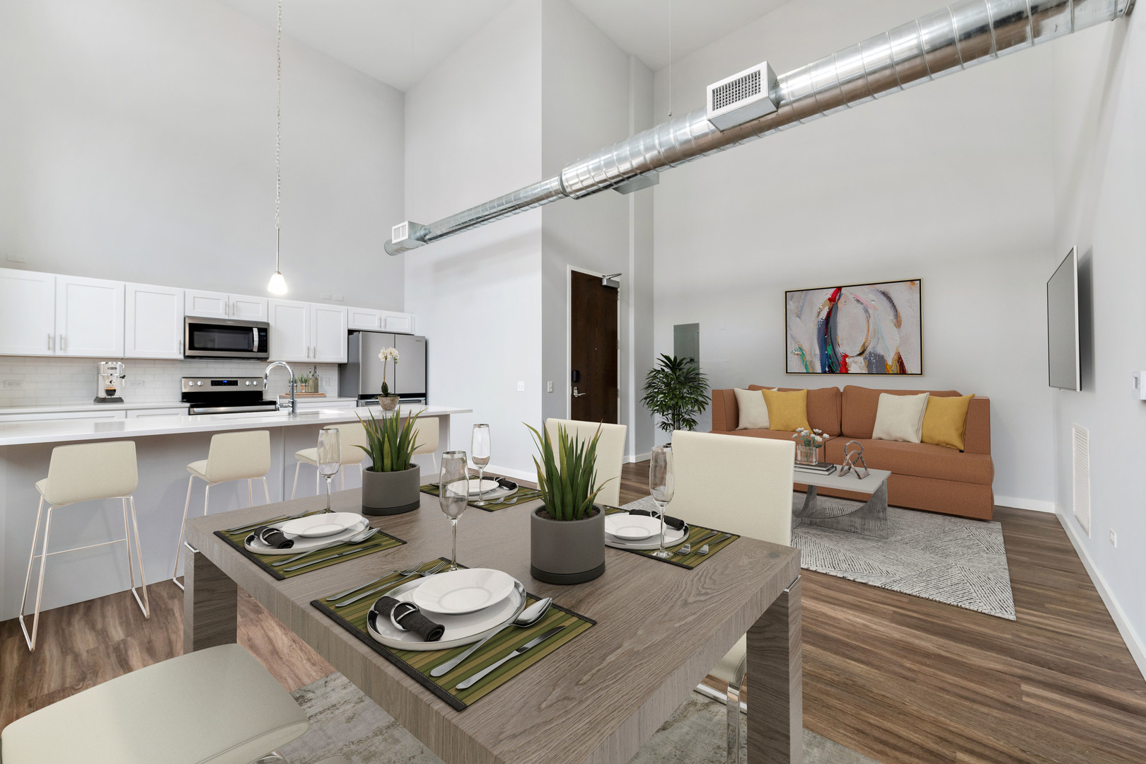 1900 West Lawrence Avenue, Unit 231 Chicago, IL 60640 - Photo 2 of 23 a living room with furniture and kitchen view