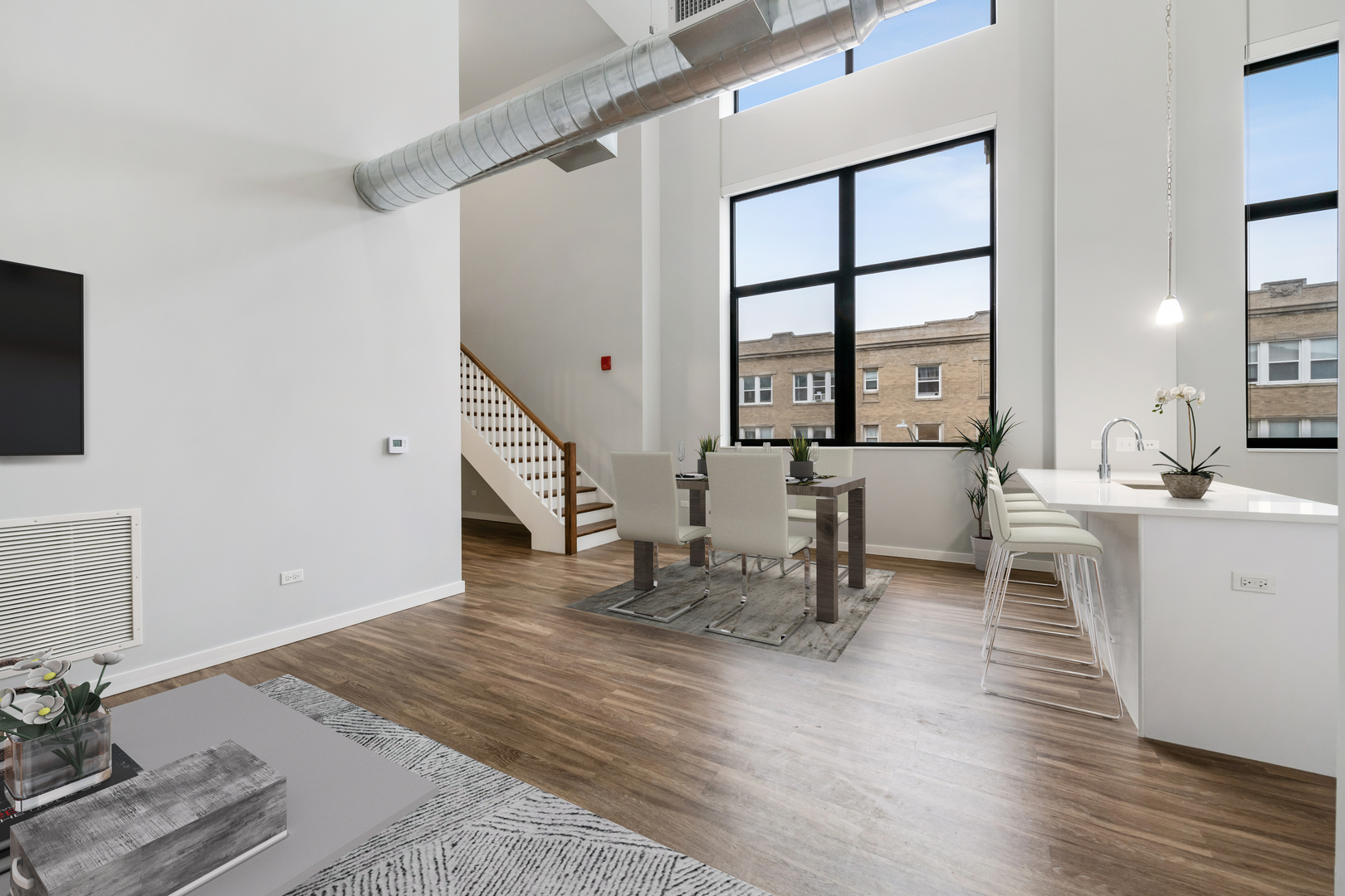 1900 West Lawrence Avenue, Unit 231 Chicago, IL 60640 - Photo 4 of 23 a living room with furniture and a table