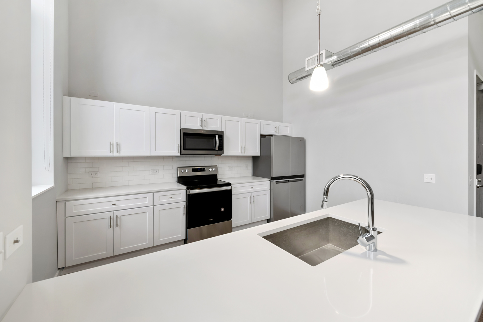 1900 West Lawrence Avenue, Unit 231 Chicago, IL 60640 - Photo 8 of 23 a kitchen with a appliances cabinets and a sink