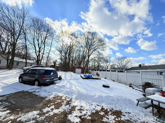 a view of a car parked in the snow