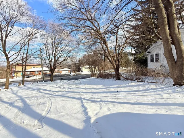 a view of a brick house with a large windows