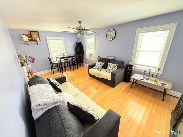 a living room with furniture and a table