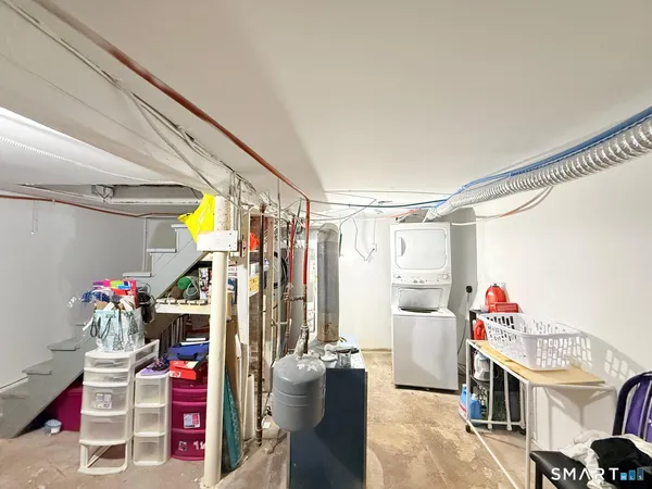 a view of a room with storage and utility room