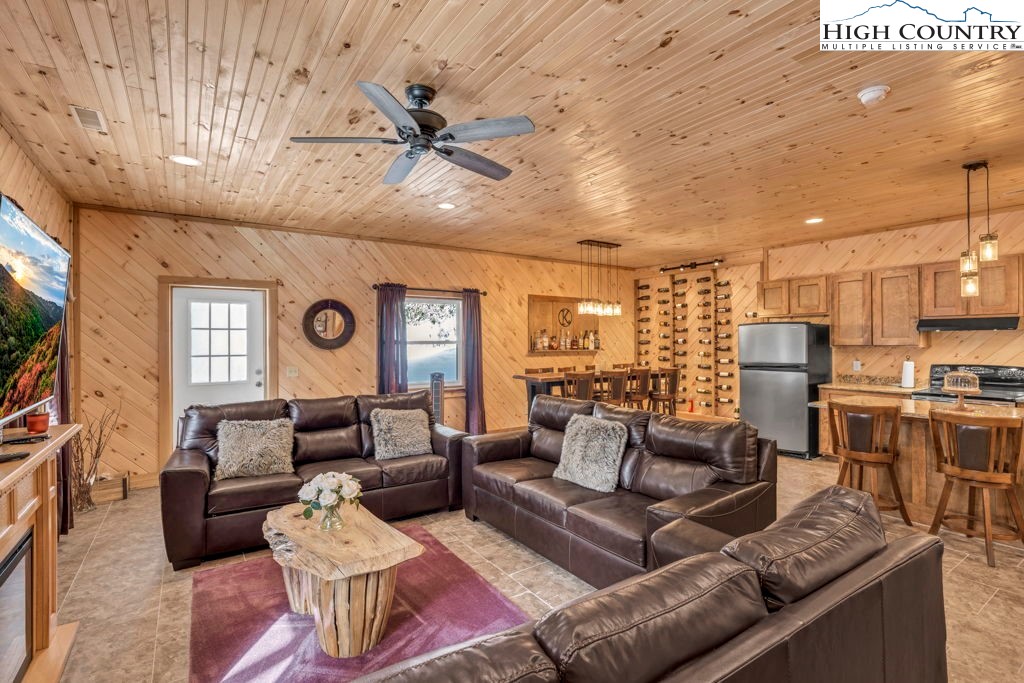 173 Spring Brook Road Newland, NC 28657 - Photo 24 of 39 a living room with furniture and a large window
