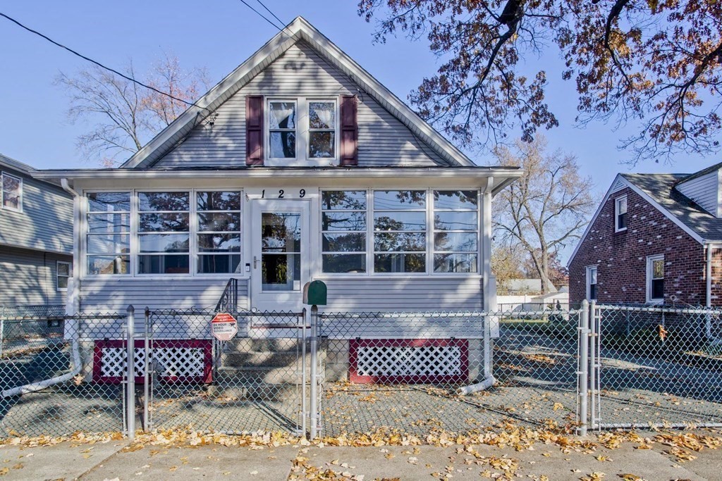 129 Eddy Street Springfield, MA 01104 - Photo 1 of 40 a front view of a house with glass walls