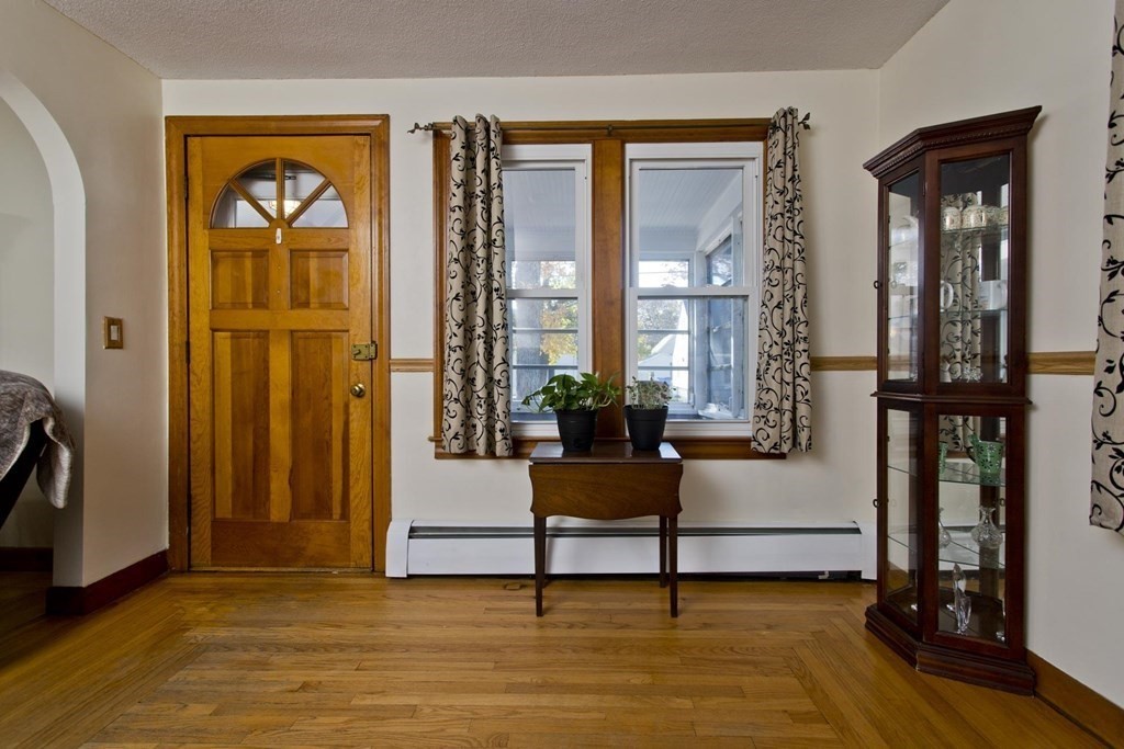 129 Eddy Street Springfield, MA 01104 - Photo 18 of 40 a living room with furniture and a window