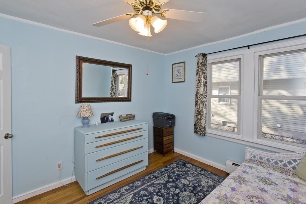 129 Eddy Street Springfield, MA 01104 - Photo 20 of 40 a bedroom with furniture and a window