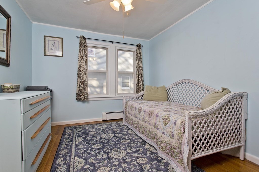 129 Eddy Street Springfield, MA 01104 - Photo 21 of 40 a bedroom with a bed and a window