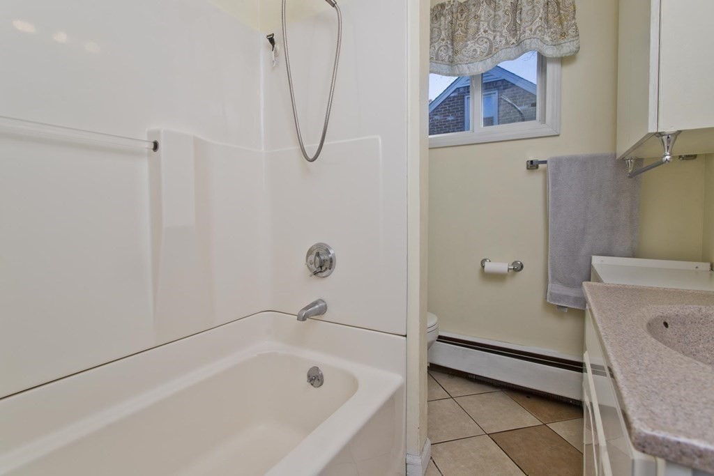 129 Eddy Street Springfield, MA 01104 - Photo 22 of 40 a bathroom with a tub and a shower